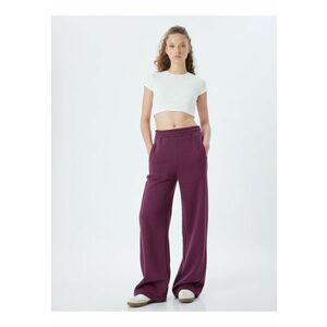 Pantaloni de trening cu croiala ampla si model uni imagine