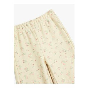 Pantaloni cu croiala ampla si model floral imagine
