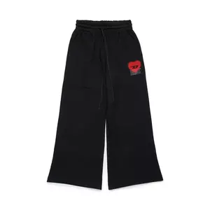 Diesel pantaloni de trening din bumbac pentru copii PCUORE TROUSERS culoarea negru, cu imprimeu, J02231 imagine